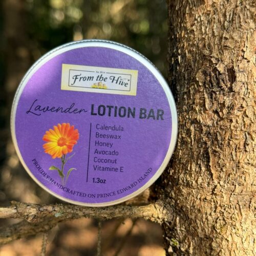 Lavender Calendula Honey moisturizing lotion bar with a honey bee imprint. A 60ml (2oz.) silver aluminum tin with screw top holds a 1.3oz solid bar.
