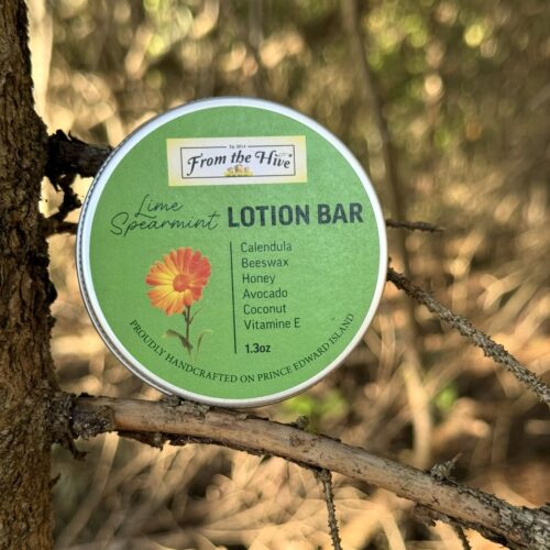 Lime Spearmint Calendula Honey moisturizing lotion bar with a honey bee imprint. A 60ml (2oz.) silver aluminum tin with screw top holds a 1.3oz solid bar.