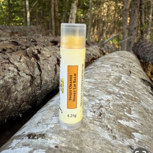 Zesty Sweet Orange Honey lip balm in a 4.25g clear plastic tube with twisted bottom for easy access. Infused with raw honey and added shea butter, apricot kernel, jojoba, avacado and vitamin e for hydration.